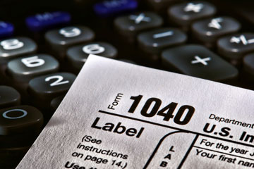 a USA income tax form 1040 and a calculator