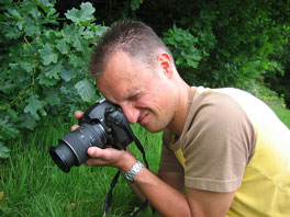 photographer shooting a photo with a digital SLR camera