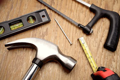 tools - hammer, level, saw, and tape measure